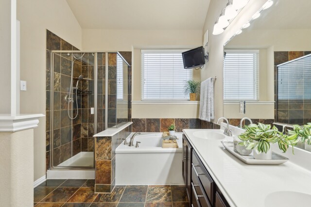 bathroom featuring vanity and plus walk in shower