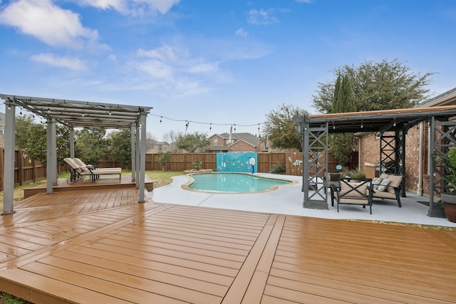 view of swimming pool featuring a fenced in pool, a fenced backyard, a deck, a patio area, and a pergola