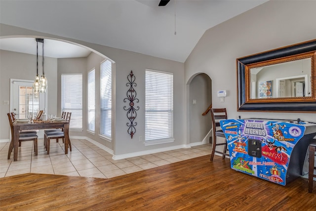 interior space with lofted ceiling and ceiling fan