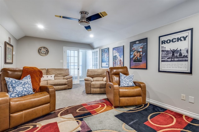 living room featuring ceiling fan, lofted ceiling, and carpet