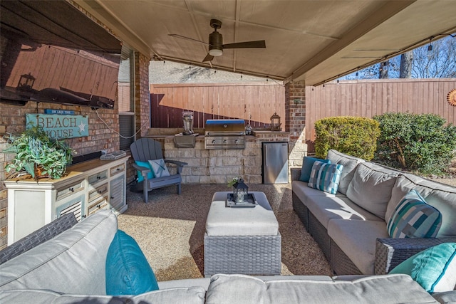 view of patio / terrace featuring ceiling fan, an outdoor kitchen, an outdoor living space, and grilling area