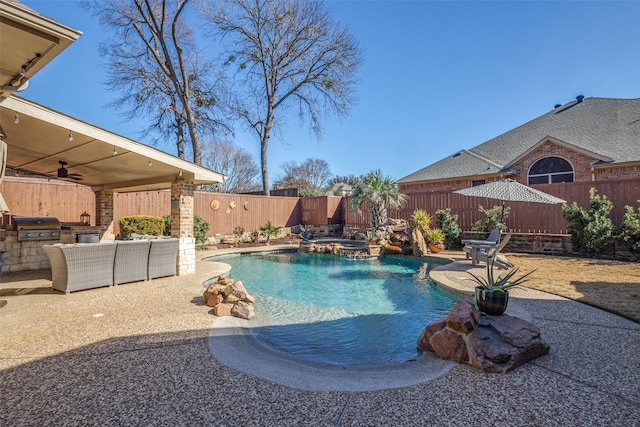 view of pool with ceiling fan, an outdoor kitchen, area for grilling, and a patio area