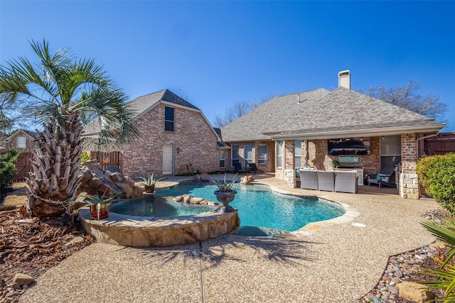 view of swimming pool featuring an outdoor living space, a patio, pool water feature, and an in ground hot tub