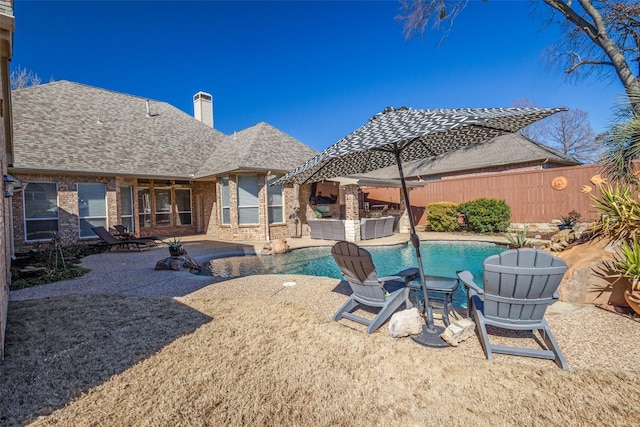 view of swimming pool featuring a patio and a jacuzzi