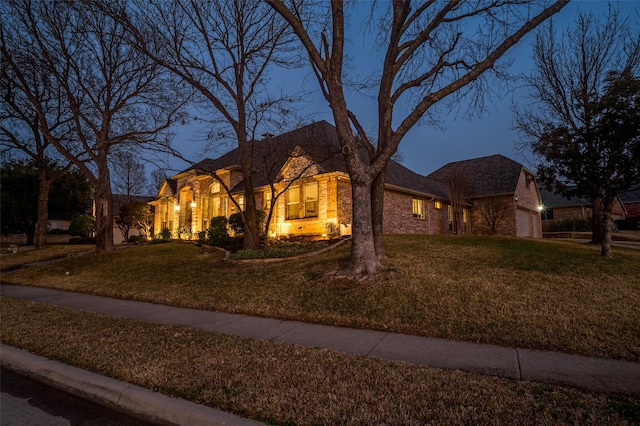 view of front of house with a garage and a front yard