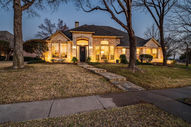 view of front of house with a yard