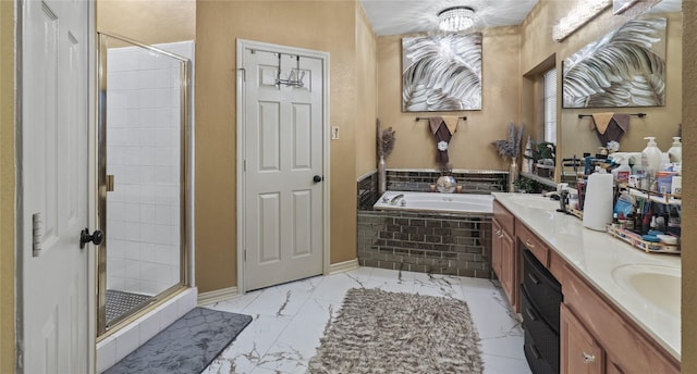 bathroom featuring vanity and separate shower and tub