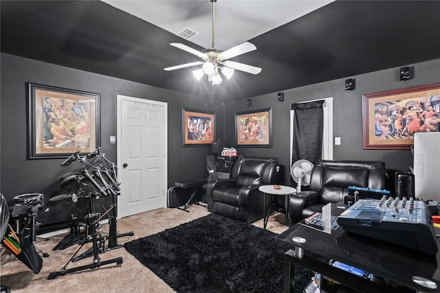 home theater room featuring carpet flooring and ceiling fan