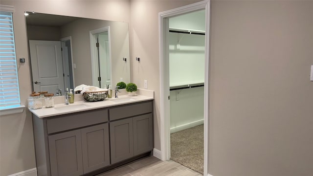 1744 River Bend Rd, Burleson, TX 76028 - full bath featuring double vanity, baseboards, wood finished floors, and a walk in closet
