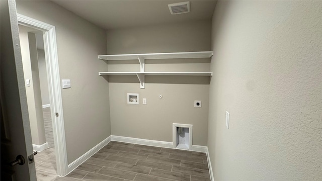 1744 River Bend Rd, Burleson, TX 76028 - laundry room with hookup for an electric dryer, gas dryer hookup, washer hookup, wood finish floors, and baseboards