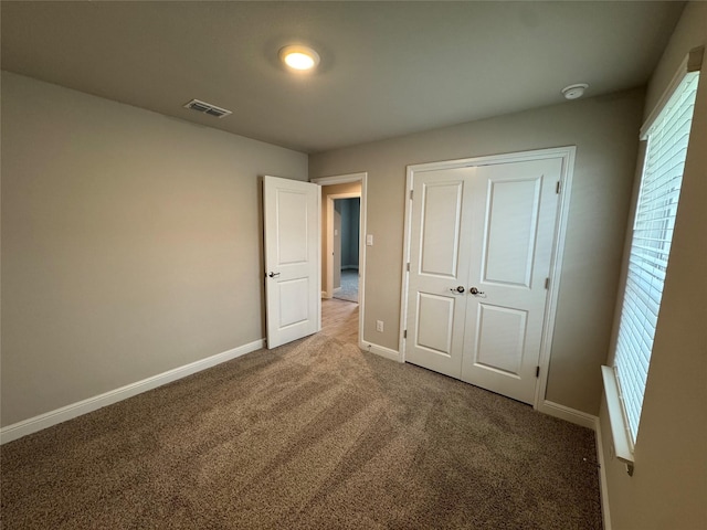 1744 River Bend Rd, Burleson, TX 76028 - unfurnished bedroom featuring carpet, baseboards, and a closet