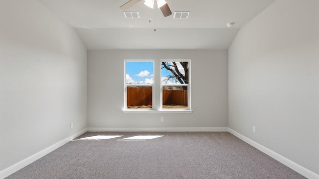 carpeted empty room featuring lofted ceiling and ceiling fan