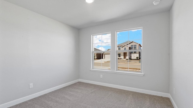 spare room featuring carpet