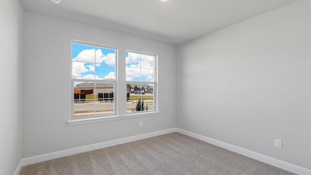 unfurnished room featuring carpet flooring