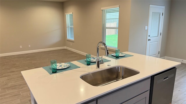 1744 River Bend Rd, Burleson, TX 76028 - kitchen with dishwasher, a sink, light wood-type flooring, and light countertops