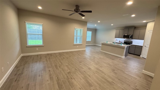 1744 River Bend Rd, Burleson, TX 76028 - kitchen featuring stainless steel appliances, gray cabinets, open floor plan, ceiling fan, and recessed lighting