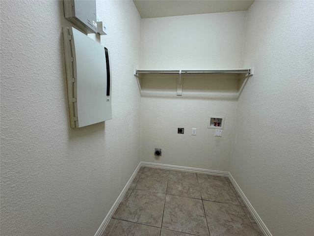 laundry area featuring light tile patterned flooring, electric dryer hookup, and washer hookup