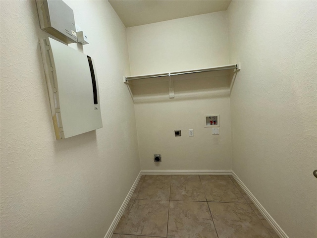 laundry room featuring washer hookup, tile patterned floors, and hookup for an electric dryer