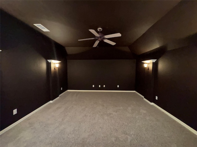 cinema featuring vaulted ceiling, ceiling fan, and carpet flooring