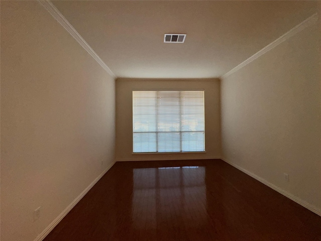 unfurnished room featuring crown molding