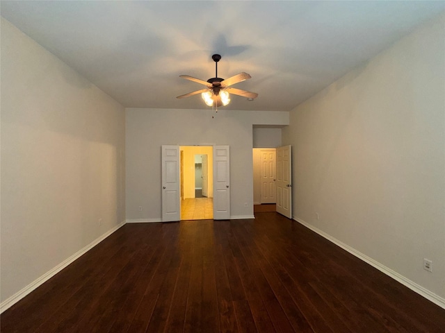 unfurnished bedroom with dark hardwood / wood-style floors and ceiling fan