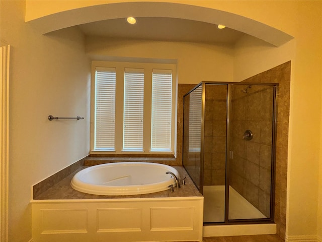 bathroom with shower with separate bathtub