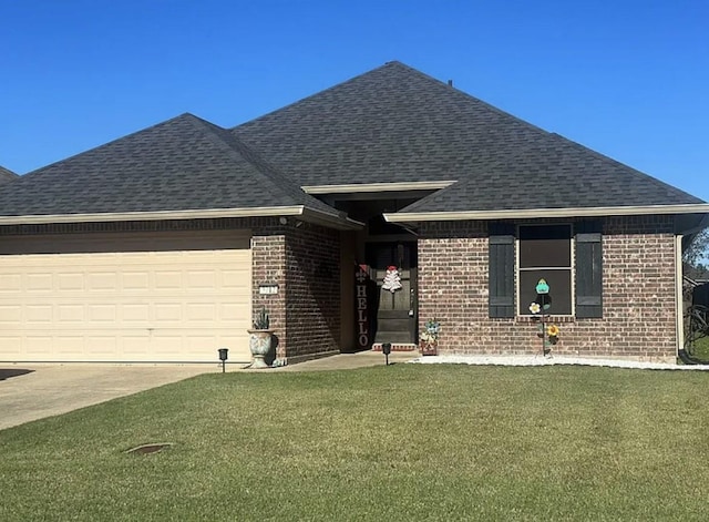 view of front of house featuring a garage and a front yard