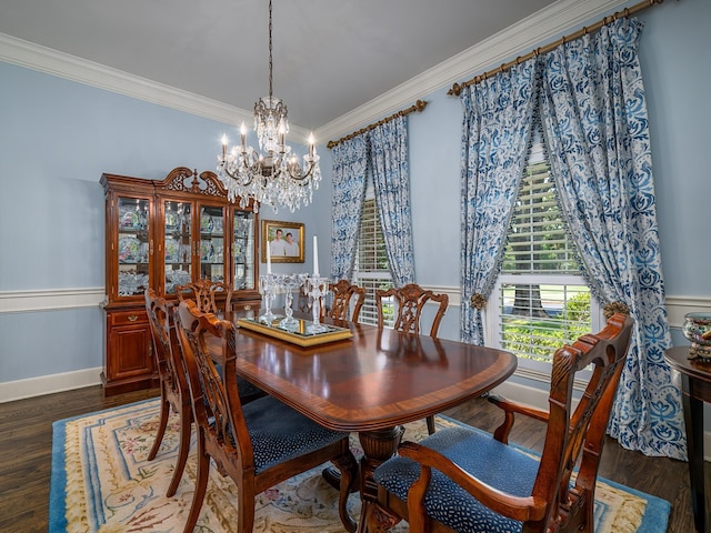 dining area with ornamental molding, an inviting chandelier, and dark hardwood / wood-style flooring