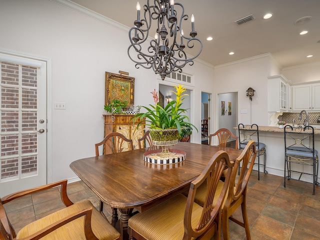 dining area featuring crown molding