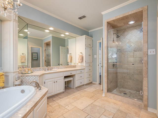 bathroom with vanity, crown molding, and independent shower and bath