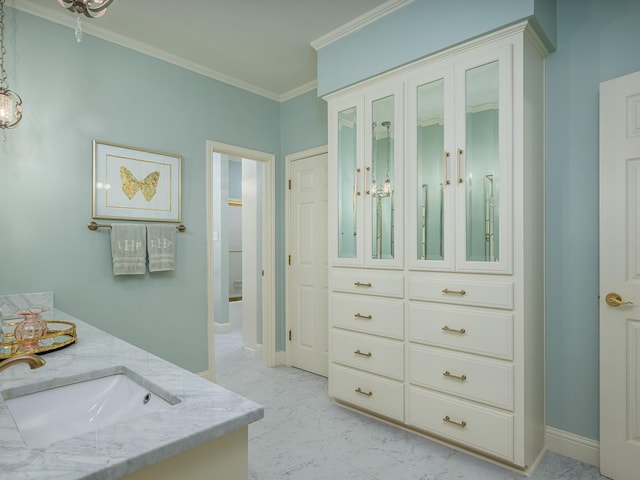 bathroom featuring vanity and crown molding