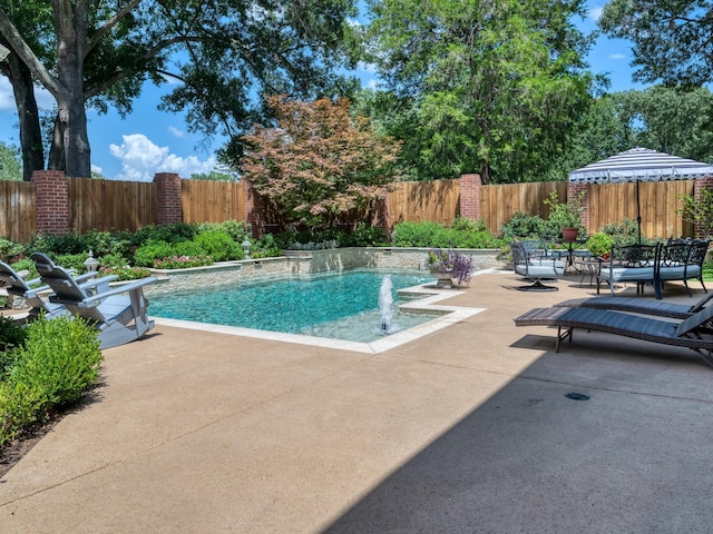 view of swimming pool featuring a patio and pool water feature