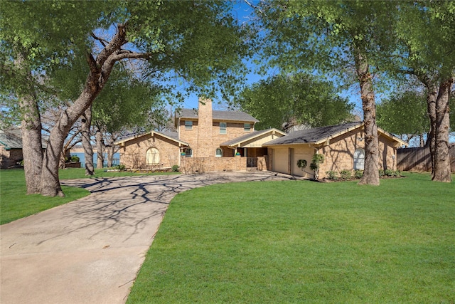 400 Driftwood Ct, Azle, TX 76020 - view of front of property featuring concrete driveway, a front lawn, a chimney, and a garage