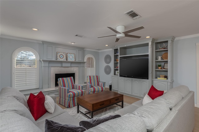 400 Driftwood Ct, Azle, TX 76020 - living area featuring crown molding, a ceiling fan, recessed lighting, and a tile fireplace