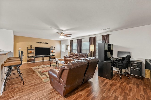 living room with ceiling fan and wood-type flooring