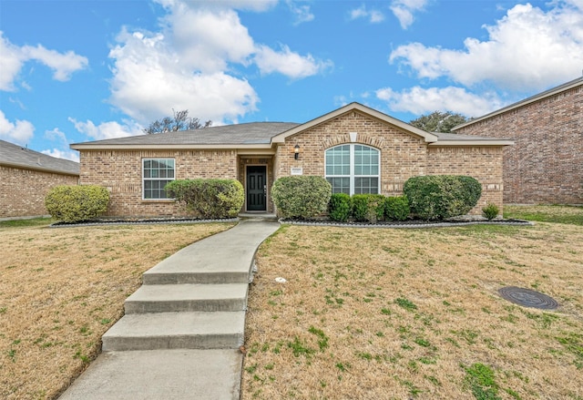 ranch-style house with a front lawn