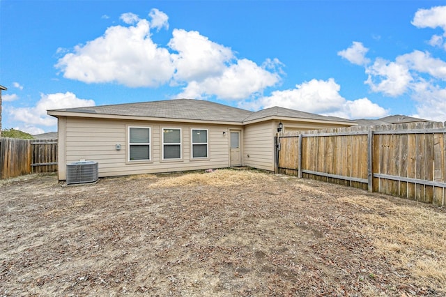 back of house featuring central AC unit