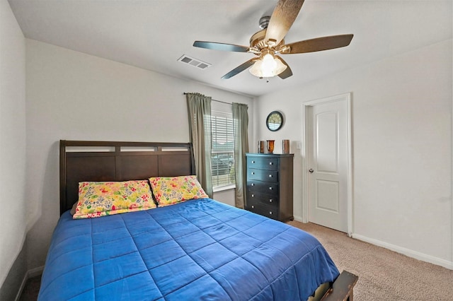 bedroom with ceiling fan and carpet