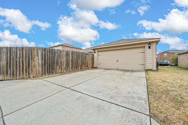 garage featuring a lawn