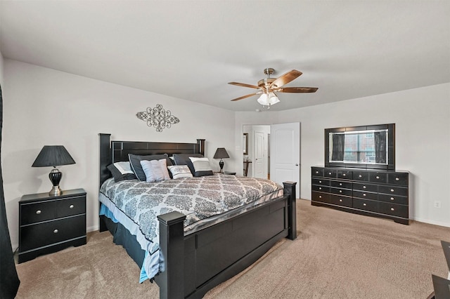 bedroom with ceiling fan and light carpet