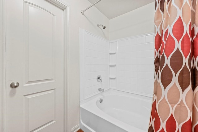 bathroom with shower / tub combo with curtain