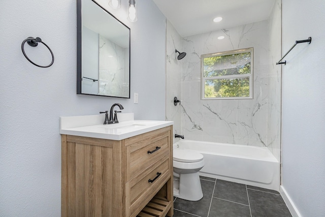 full bathroom featuring vanity, toilet, tiled shower / bath combo, and tile patterned flooring