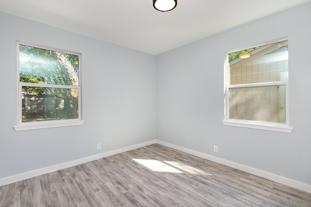 spare room featuring light hardwood / wood-style floors