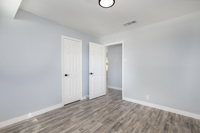 unfurnished room featuring wood-type flooring