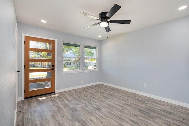 entryway featuring ceiling fan and light hardwood / wood-style floors