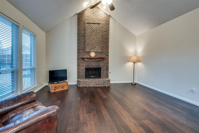 living room with lofted ceiling, a brick fireplace, baseboards, and dark wood-type flooring