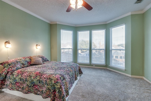 bedroom featuring baseboards, carpet, a ceiling fan, and crown molding