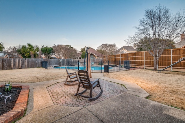 view of patio / terrace with a fenced backyard and a fenced in pool