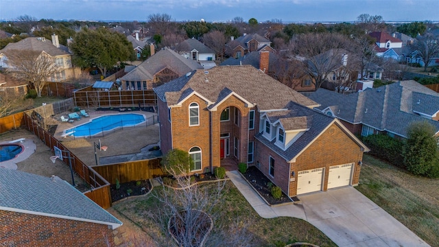 birds eye view of property with a residential view