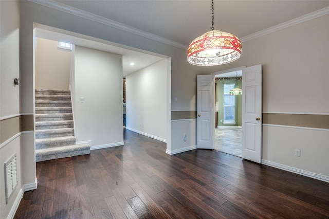 unfurnished dining area featuring ornamental molding, dark wood-style flooring, visible vents, and stairway